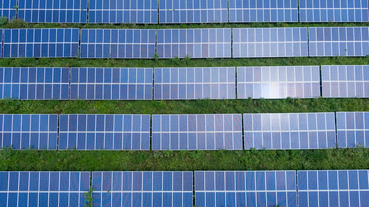 services-01 Aerial shot of a solar panel array generating renewable energy in Trenton, Georgia.